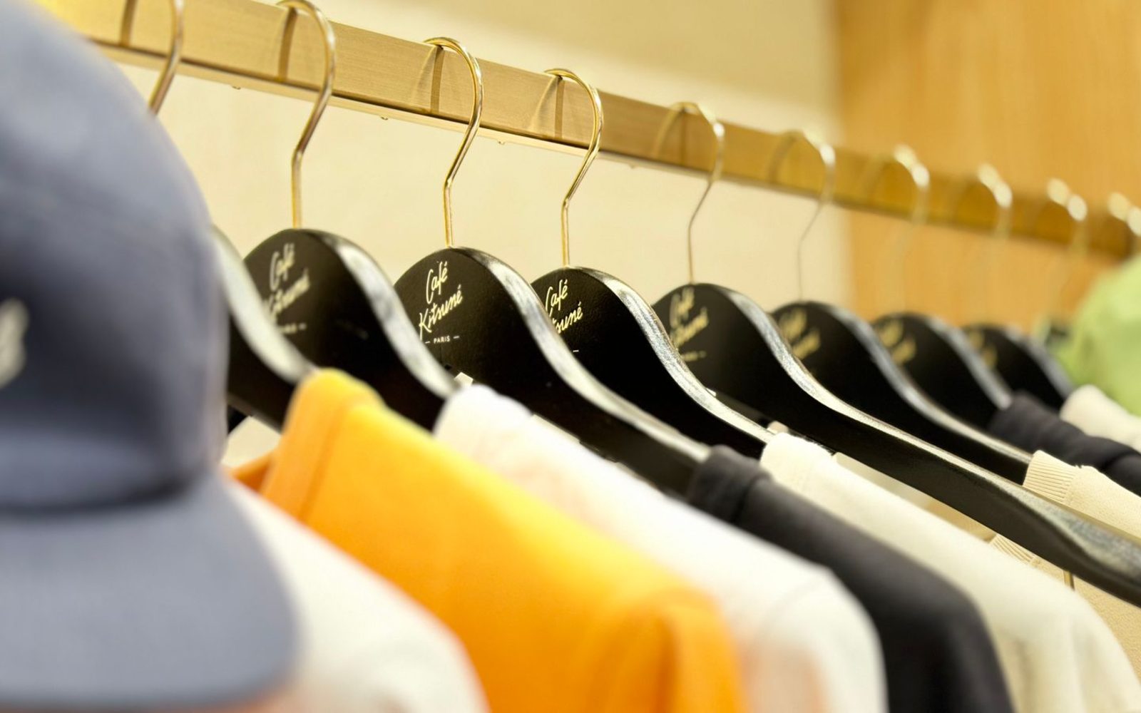 Racks of graphic tees and caps on display at a Saigon streetwear stall