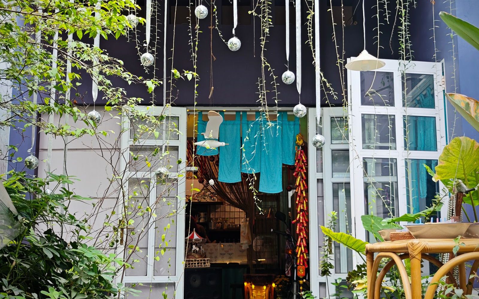 Beyond District 1: Five Saigon Neighborhoods Worth a Half-Day 2 Leafy garden cafe with lush plants and outdoor seating in Thao Dien, Saigon