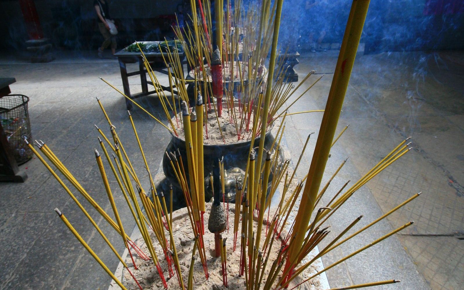Burning incense sending up smoke inside the Thien Hau Temple in Cholon, Saigon